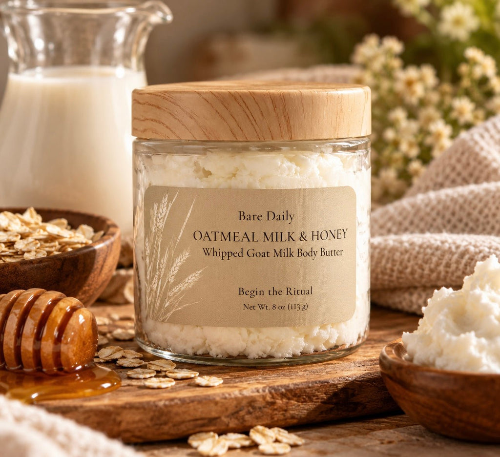 Bare Daily Oatmeal Milk & Honey Whipped Goat Milk Body Butter 8 oz jar with a wood grain lid on a rustic table with a honey dipper, rolled oats, and a milk pitcher.